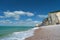 Beach, blue sea and cliffs in Etretat, France