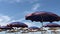 Beach blue umbrellas at Adriatic sea in Albania close to Durres.