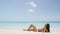 Beach body woman sun bathing sexy on vacation travel getaway