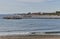 Beach with breakwater in Marbella, summer day