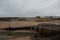 The beach at Bude, Cornwall with the town behind and canal sea lock in the foreground.