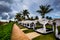 Beach Cabanas spread out along tropical ocean shore