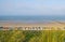 Beach cabins along hilly dunes on a recreational beach in spring