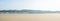 Beach cabins along hilly dunes on a recreational beach in spring