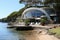 Beach cafe in the coast of the island of Tenerife, Photograph of large lagoon beach with minimalist architectural white slate