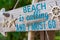 Beach is calling saying on a wooden board vacation inspirational quote conceptual photo