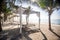 Beach canopy among palms by Indian Ocean