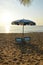 Beach canvas beds with blue and white umbrella