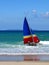 Beach: catamaran sailing in surf - close