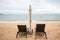 Beach chair and the big umbrella and was on the beach. Beautiful beach. Chairs on the sandy beach near the sea. Summer holiday and