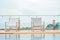 Beach chair by the pool on the rooftop hotel.