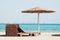 Beach chair with straw sunshade