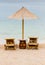 Beach chair and umbrella on sand beach. Concept for rest, relaxation, holidays, spa, resort