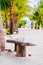 Beach chairs, palm trees and beautiful white sand beach in tropical island