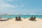 Beach chairs, umbrella on the beach.