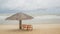 Beach Chairs and Umbrella on a beautiful island, panoramic view with much copy space.