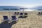 Beach chairs with umbrella on the shore of Tavira Island