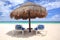 Beach chairs under palapa thatched umbrella