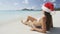 Beach christmas vacation holidays travel concept - bikini girl in santa hat