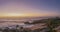 beach and church under the orang light of the sunset