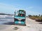 Beach cleaning equipment picking up debris on a Florida beach.