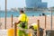 Beach cleanup workers cleaning garbage containers at Barceloneta beach in Spain
