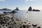 The beach with cliffs of Cyclops Faraglioni dei Ciclopi near Aci Trezza town in Sicily. These large stones are believed to be