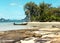 The beach with coconut trees and fishing boat.The Islands Of Thailand.