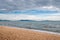 The beach with coming rainy storm cloud