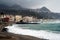 beach and concrete quay during a storm in the city of Naxos on the island of Sicily