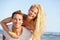 Beach couple fun - lovers on romantic travel