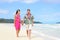 Beach couple on Hawaii vacation with Hawaiian leis