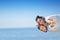 Beach couple laughing in love romance on travel honeymoon vacation