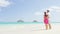 Beach couple looking at ocean view on Hawaii