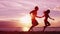 Beach couple running having fun holding hands on beach enjoying romantic sunset