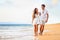 Beach couple walking on romantic travel