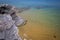 Beach with crystalline and transparent waters of bluish and greenish colors with golden sand