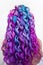 Beach curls on long colored hair. Bright color coloring, fashion and style.