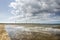 Beach, dam and clouds