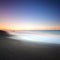 Beach dark sand and sea on morning. Tuscany Italy