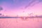 Beach dinner set-up. Sunset sky and chairs and table for romantic couples background