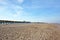 Beach district called `Paal 20` with beach huts in distance on island Texel in the netherlands on summer day with blue sky