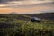 Beach dunes in Iceland with a SUV and volcanos in the background during the midnight sun..15/06/2019 - Hella, Iceland