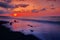 The beach at dusk in purple red and slightly dark