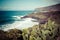 Beach el Bollullo black brown sand and aqua water near Puerto de