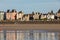 Beach in the evening sun and buildings along the seafront promenade in Saint Malo. Brittany,