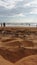 Beach filled with dirt and waste in Kerala, India.