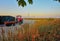 Beach with fisherman's house and red tractor in Ahlbeck. Germany