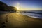 Beach footprints towards the sun