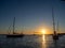 Beach in the Formentera island with sailboats and yacht in the water anchored